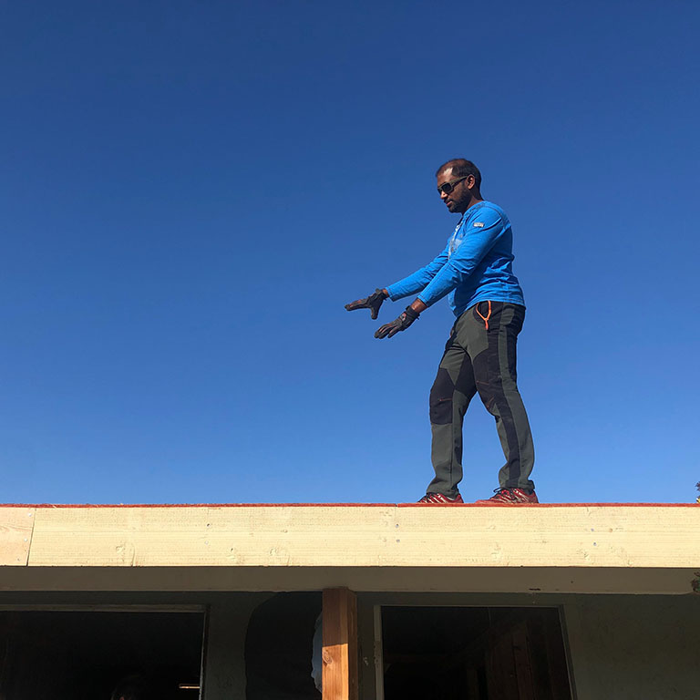 Siv Shanmugam on the roof of home