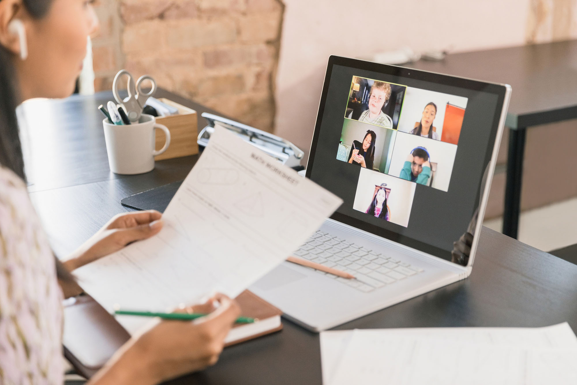 Teacher teaching students virtually