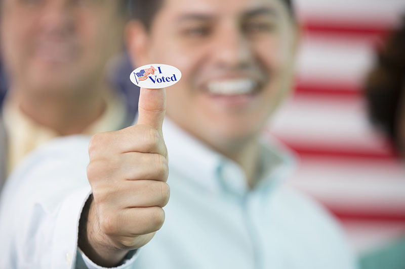 Photo of man with a thumbs up that just voted for a campaign.